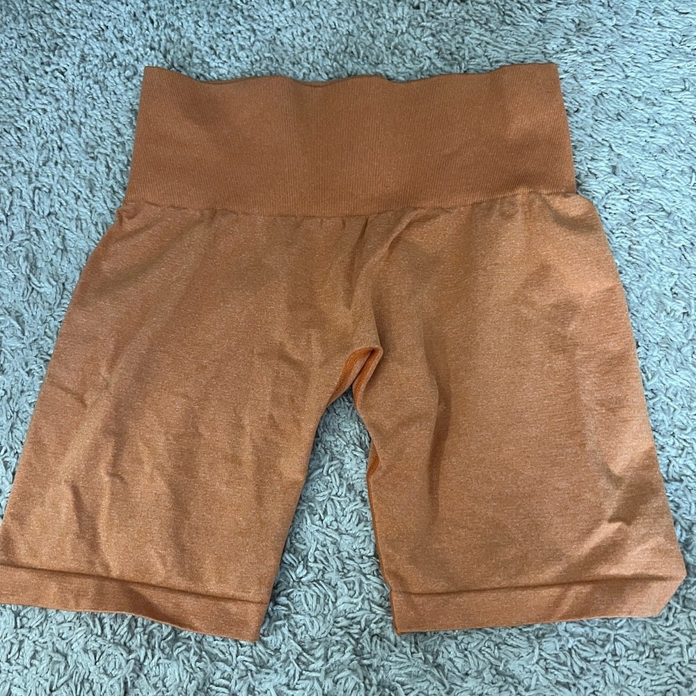 Orange NVGTN biker shorts